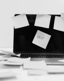 Laptop with Help sticky notes